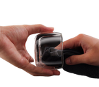 Hand cleaning the smooth clear glass cup from the portable tea infuser set