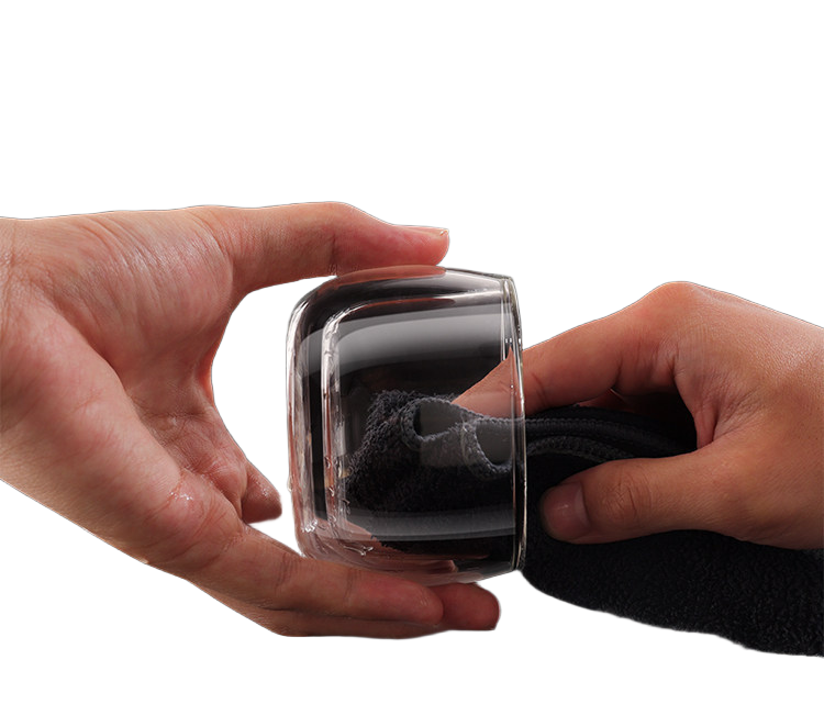 Hand cleaning the smooth clear glass cup from the portable tea infuser set