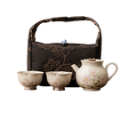 Front view of BRUNMIIA floral ceramic tea set for two with soft-sided carry bag
