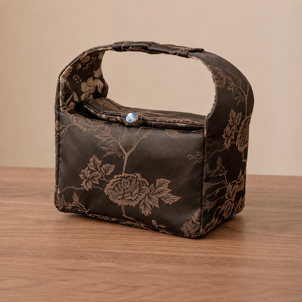 Brown floral-patterned soft carry bag for the BRUNMIIA ceramic travel tea set