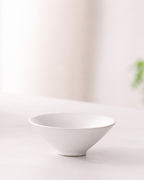 White shallow ceramic tea cup from the BRUNMIIA portable tea set